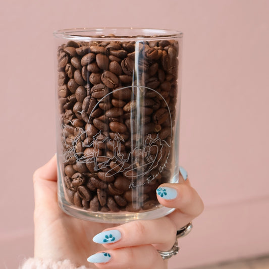 Pint Glass full of coffee beans with surfers printed on it