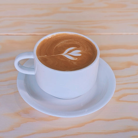 Steamed milk poured over rich espresso and finished with a thin layer of foam; small size includes 2 shots and large includes 3 shots.