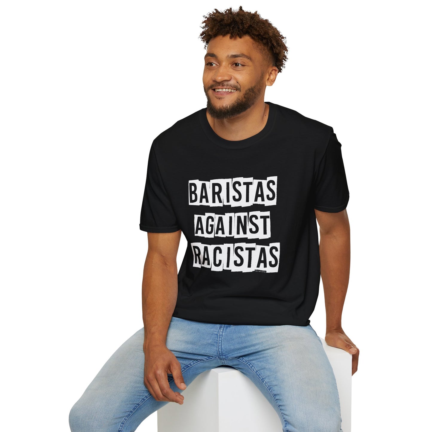 Man sitting while wearing a black shirt that says Baristas Against Racistas