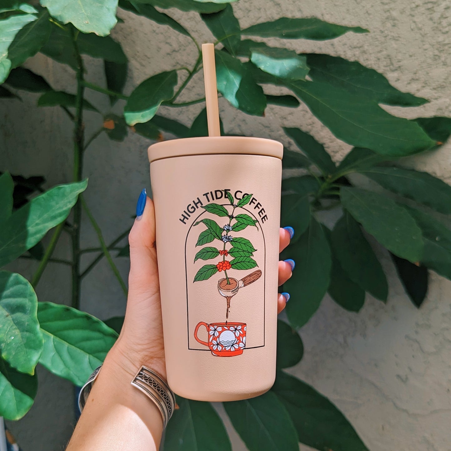 insulated iced drink tumbler with custom coffee plant art printed on it