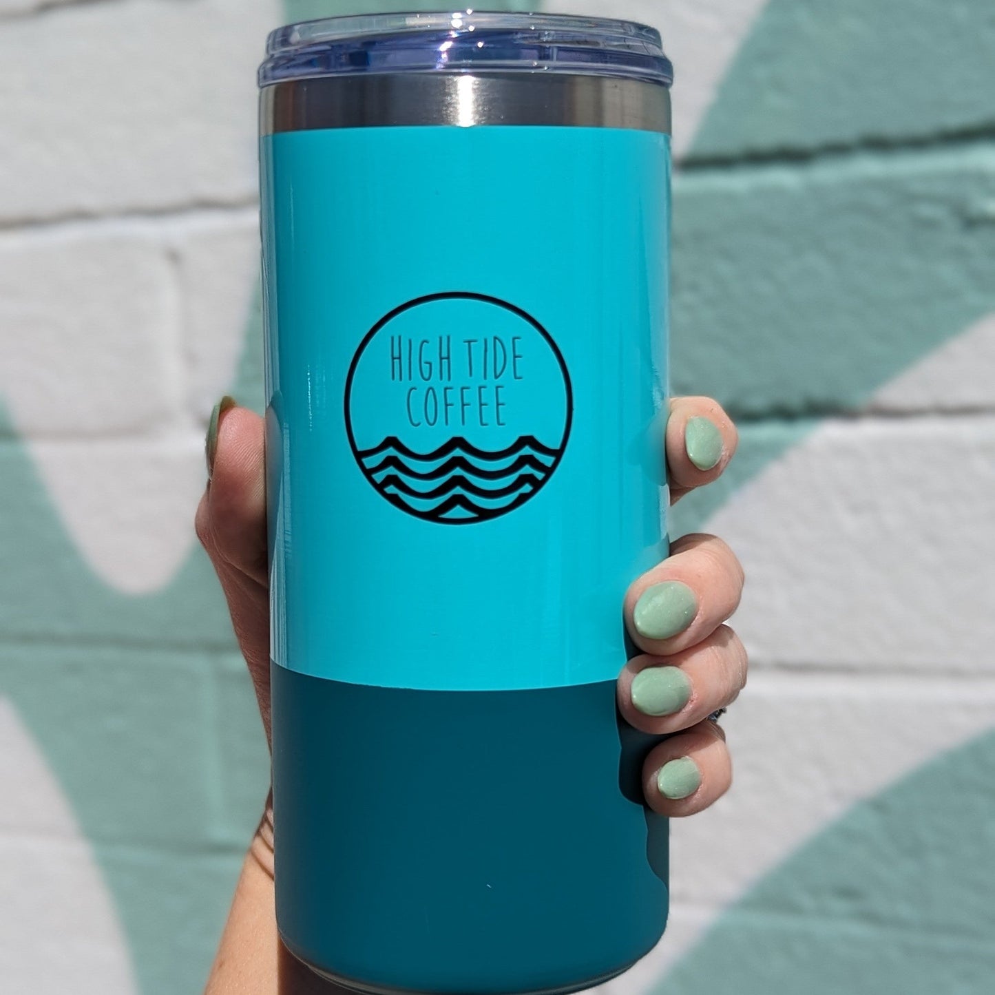 Back of a coffee tumbler with High Tide Coffee Logo printed on it